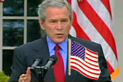Bush with flag lapel pin